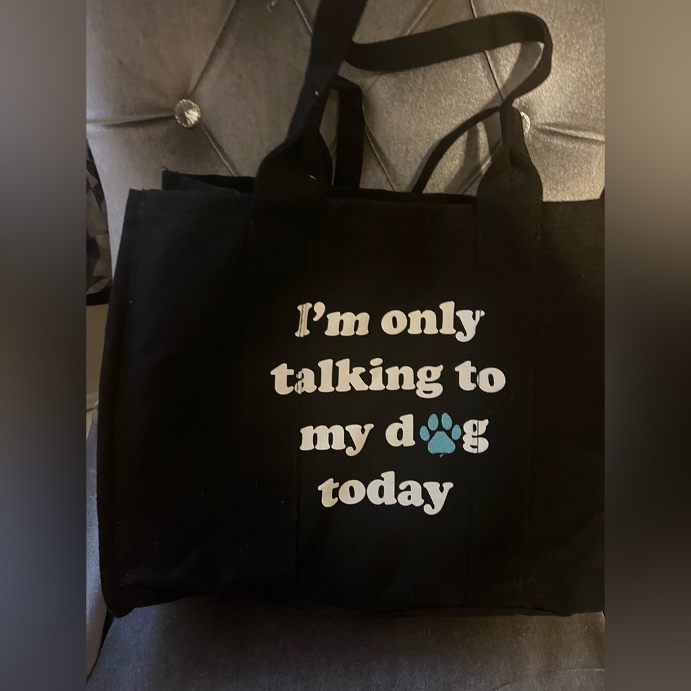 The cutest dog tote for your balls collars water,  snacks etc for your doggy